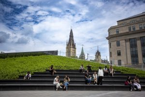 People sit at the Bank of Canada Museum
