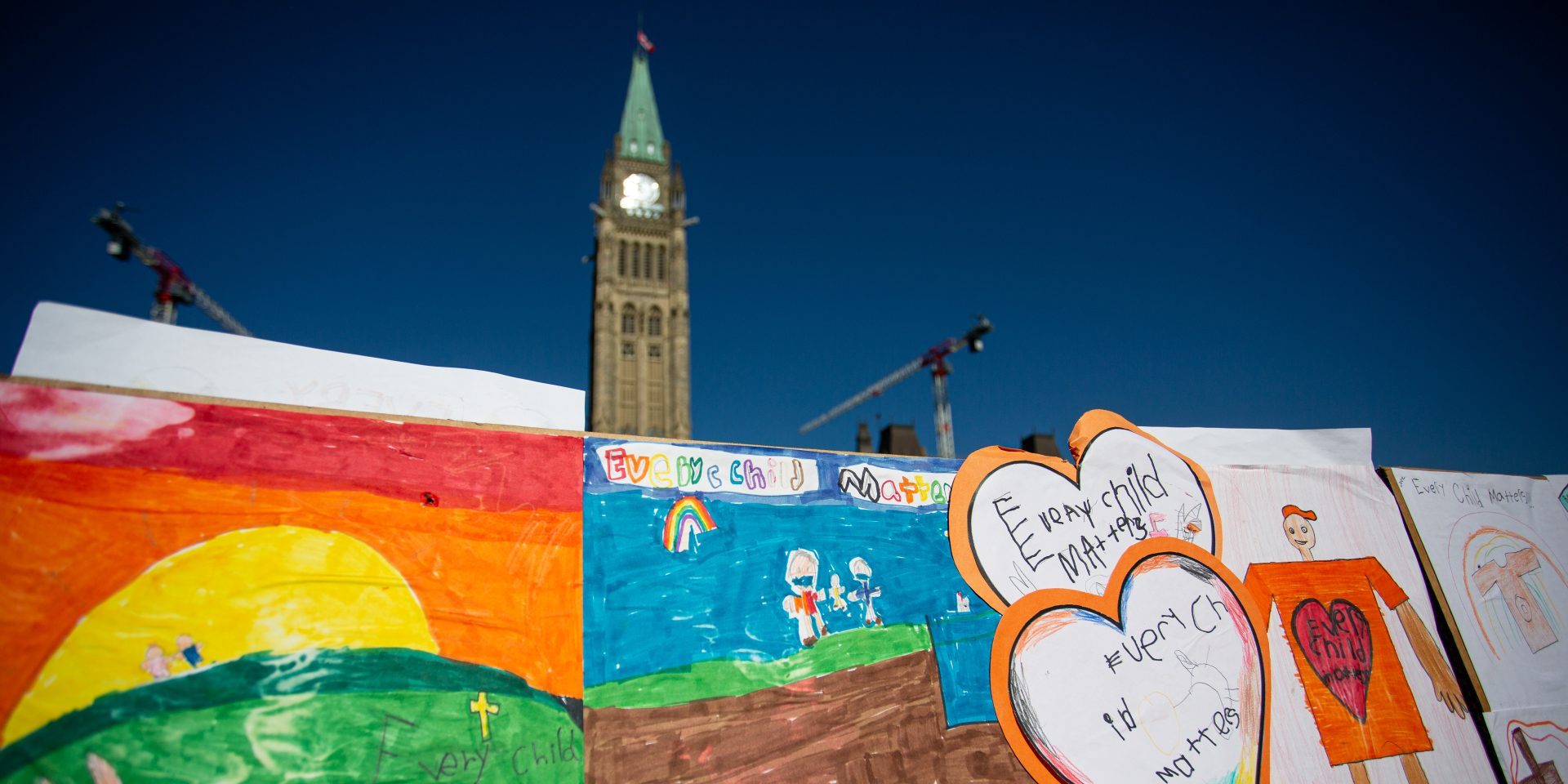 Posters cover the fence at the National Truth and Reconciliation day ceremony on Parliament Hill on Sept. 30, 2022. The Hill Times photograph by Andrew Meade