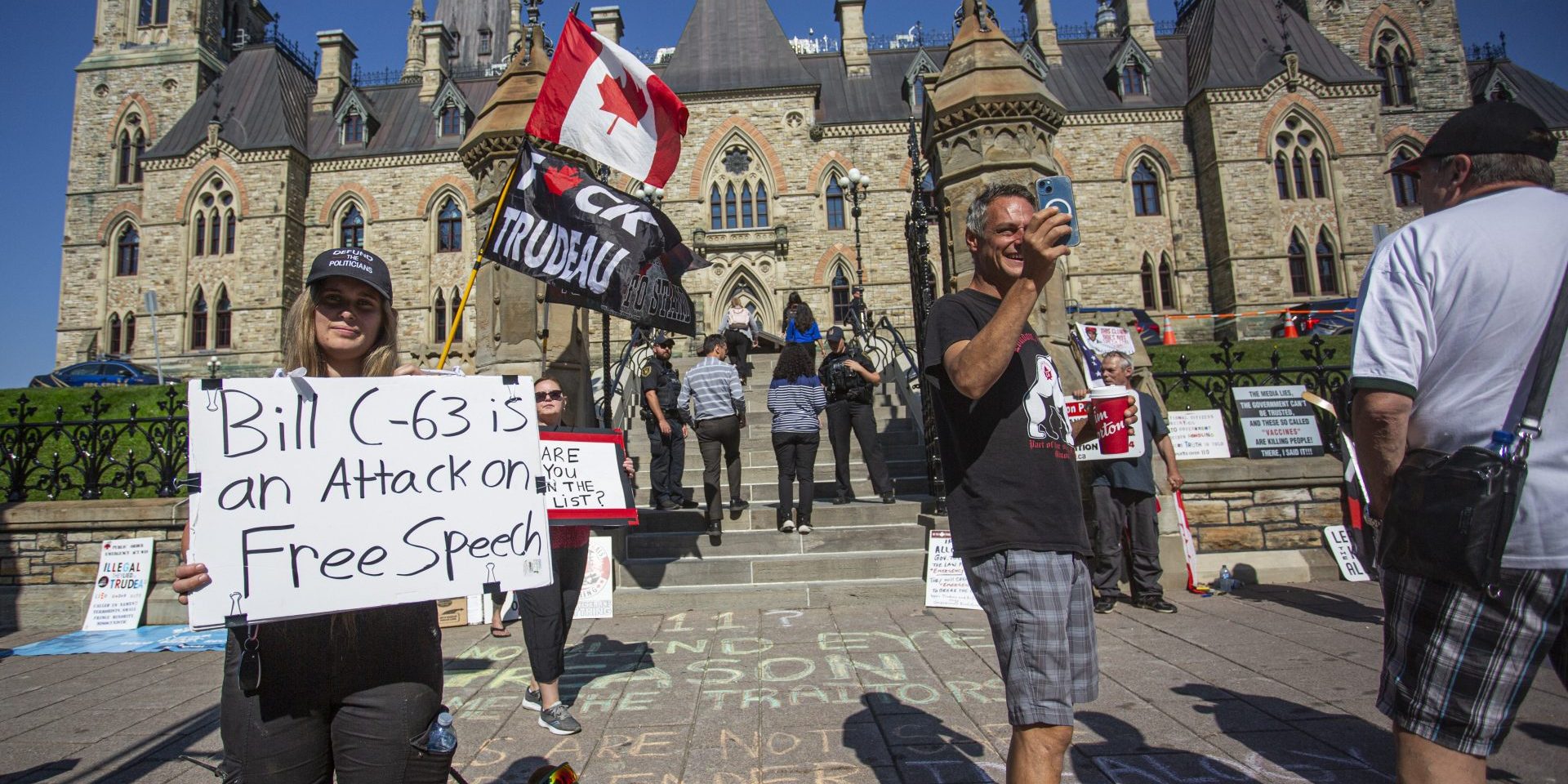 Freedom movement supporters protest at the south stairs outside West Block