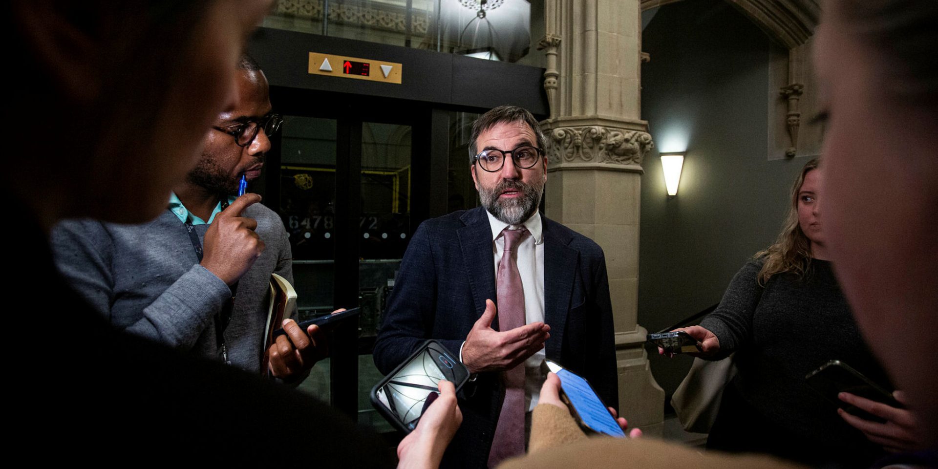 Steven Guilbeault speaks with reporters in the West Block.