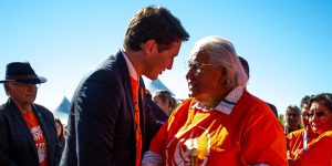 Prime Minister Justin Trudeau shakes hands with Senator Murray Sinclair