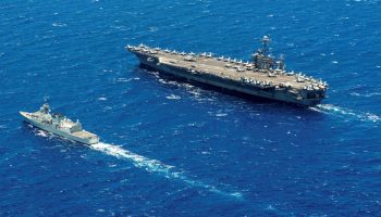 160801-N-TU932-127 PACIFIC OCEAN (Aug. 1, 2016) Royal Canadian Navy Halifax-class frigate HMCS Calgary (FF 335) steams alongside Nimitz-class aircraft carrier USS John C. Stennis (CVN 74) during Rim of the Pacific 2016. (U.S. Navy photo by Mass Communication Specialist 3rd Class Sierra D. Langdon)