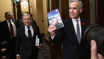 Prime Minister Mark Carney and Minister of Finance and National Revenue François-Philippe Champagne take the 2025 budget into the House of Commons to table iton  Nov. 4, 2025. The Hill Times photograph by Andrew Meade