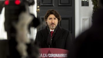 Prime Minister Justin Trudeau holds a media availability in front of his home at Rideau Cottage in Ottawa on Feb. 12, 2021 to give an update on the government’s response to the second wave of the COVID-19 pandemic. Trudeau announced that as of Feb. 15 all travellers entering Canada at a must negative PCR test and are required to take a test upon arrival as well as a mandatory 14-day quarantine.