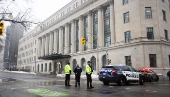 Police and fire departments block off Wellington Street between O’Connor and Bank streets on Dec. 10 after 180 Wellington is evacuated following reports of a suspicious package. The Hill Times photograph by Andrew Meade