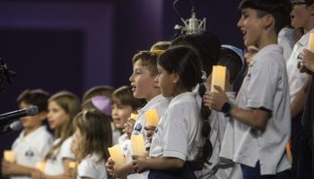 The Ottawa Jewish Community School’s choir sings the Israeli national anthem at the Infinity Convention Centre in Ottawa on Oct. 7, 2024, commemorating the one year anniversary of the Hamas attack on Israel. The Hill Times photograph by Andrew Meade