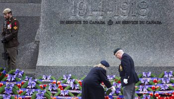 A pair of veterans lay a wreath during the National Remembrance Day ceremony at the National War Memorial in Ottawa on Nov. 11, 2024. The Hill Times photograph by Andrew Meade