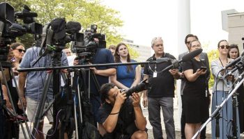 Andrea Sandmaier, President of the Otipemisiwak Métis Government, scrums with reporters as he leaves the Metis Major Projects Summit in Ottawa on Aug. 7,  2025. The Hill Times photograph by Andrew Meade
