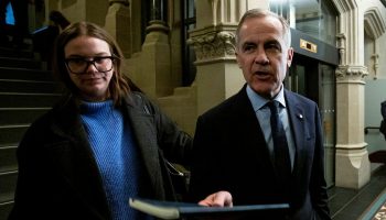 Newly elected party leader Mark Carney arrives for the Liberal Party caucus meeting in West Block on March 10, 2025. The Hill Times photograph by Andrew Meade