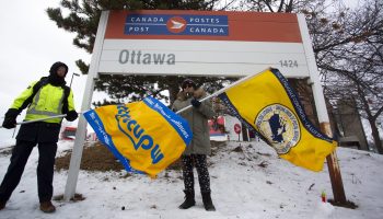 Canadian Union of Postal Workers members picket outside Canada Post Station T in Ottawa on  Dec. 12, 2024. The Hill Times photograph by Andrew Meade