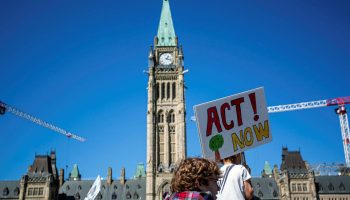 Hundreds of people gather on Parliament Hill on Sept. 15, 2023, for a global climate strike action to bring awareness and action to address climate change.
