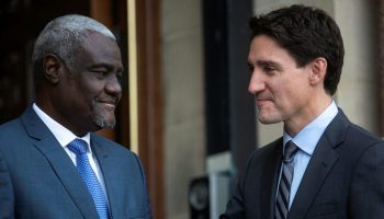 Prime Minister Justin Trudeau greets Chairperson of the African Union Commission, Moussa Faki Mahamaton.